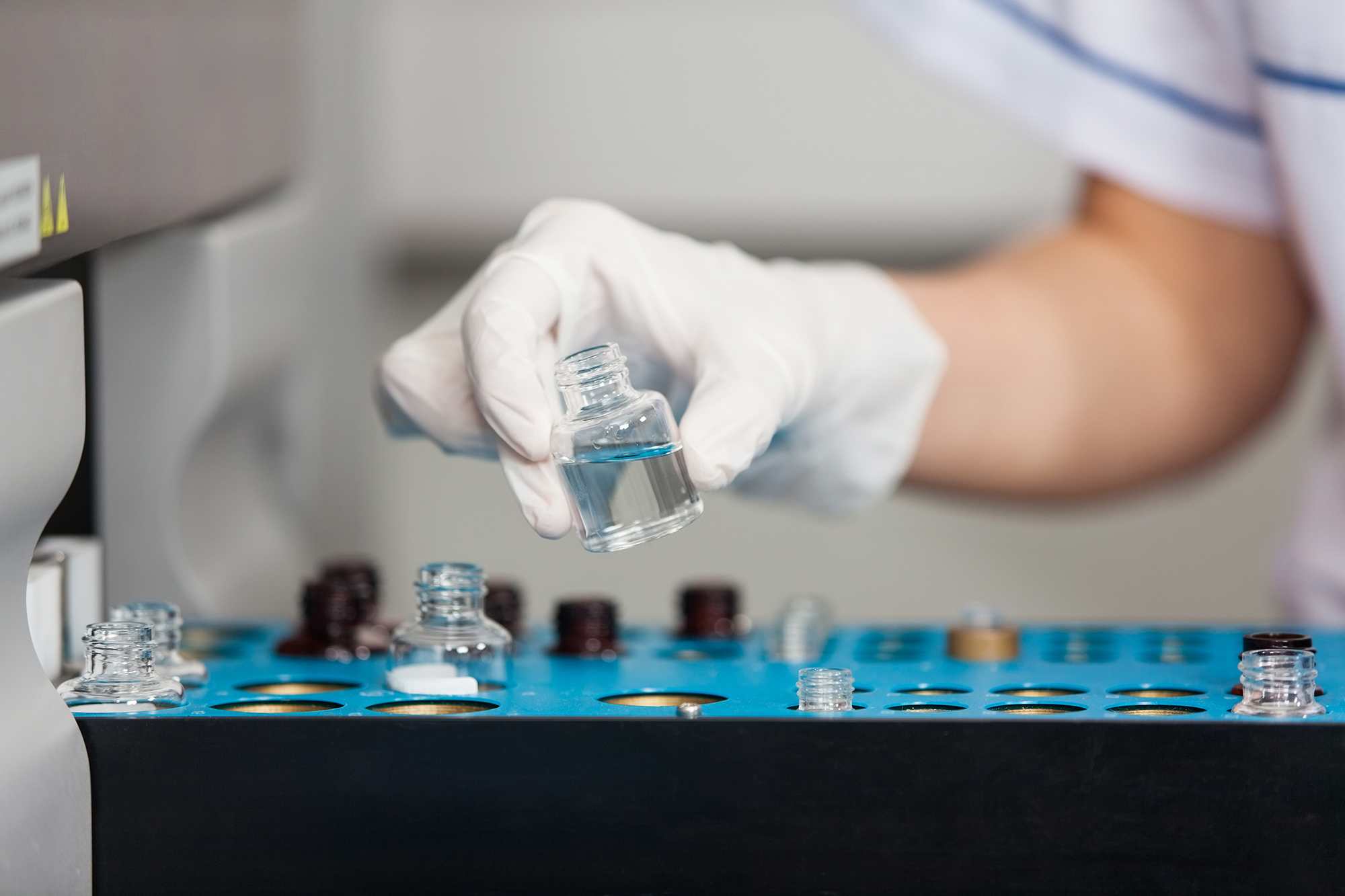 woman in lab with vials